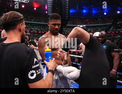 Anthony Joshua reacts to defeat by Daniel Dubois following the IBF World Heavy weight bout at Wembley Stadium, London. Picture date: Saturday September 21, 2024. Stock Photo