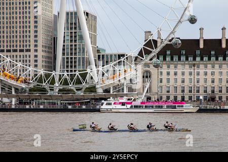 London, UK. 21st Sep, 2024. A rowing boat in front of the London Eye. Boating crews from all over the World take part in London's Great River Race to raise money for charities. The river marathon covers 21.6 miles and starts at Millwall in the east of London and finishes at Richmond in the west of London. Credit: SOPA Images Limited/Alamy Live News Stock Photo