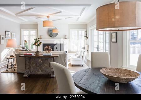 Casual round dining table in foreground with great room in background Stock Photo