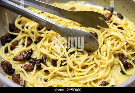 Classic spaghetti carbonara sauce with guanciale, pecorino cheese and eggs Stock Photo