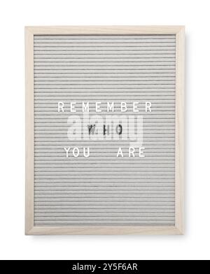 Letter board with phrase Remember who you are on white background, top view Stock Photo