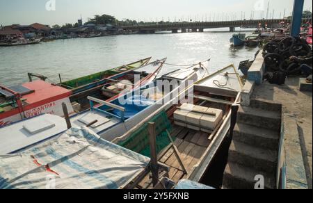 Balikpapan, East Borneo, Indonesia-September 19. A row of boats are docked at a pier Stock Photo