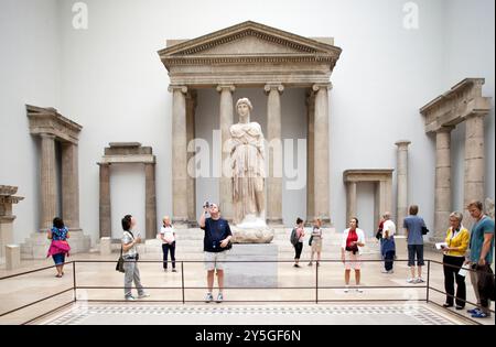 Berlin, Germany, July 24 2009, Visitors admire Hellenistic architecture pieces from Magnesia and Priene in the Pergamon Museum's spacious interior. Stock Photo