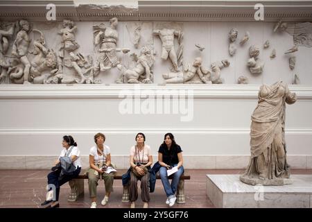 Berlin, Germany, July 24 2009, Tourists explore the intricate Hellenistic sculptures of the Pergamon Altar at the Pergamon Museum in Berlin, Germany. Stock Photo