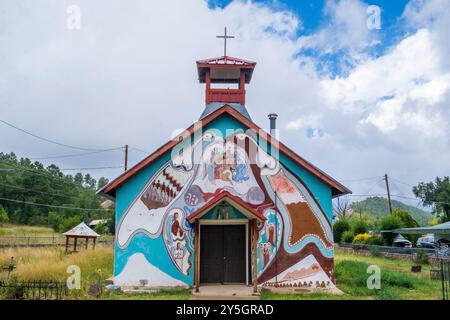 Unusual mural on the side of a small Catholic church, Las Vegas, New Mexico, USA Stock Photo