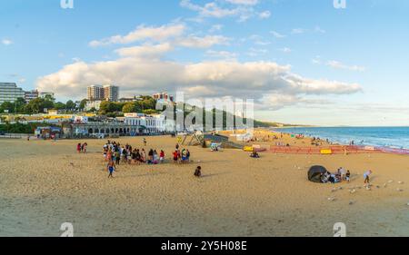 East Cliff Beach, Bournemouth, UK - July 21st 2024: People on the beach near the zip wire tower. Stock Photo