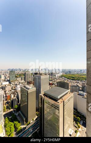 High rise office blocks and Tokyo skyline seen from the observation floor of the Metropolitan building. Shinjuku NS Building and Gyoen National Garden Stock Photo