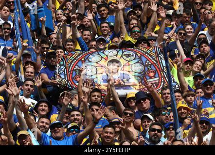 Buenos Aires, Argentina. 21st Sept 2024. Boca Juniors’ supporters cheer for their team during the Argentine Professional Football League Tournament 2024 'Cesar Luis Menotti' match against River Plate, at La Bombonera stadium in Buenos Aires, on September 21, 2024. Credit: Alejandro Pagni/Alamy Live News Stock Photo