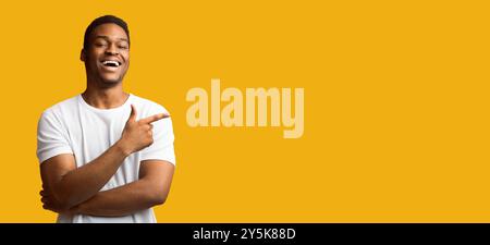 African american man pointing aside at empty space Stock Photo