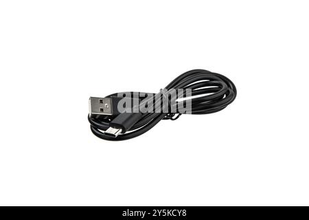 A black USB cable is coiled up on a white background. The cable has a standard USB-A connector on one end and a USB type-c connector on the other. Stock Photo