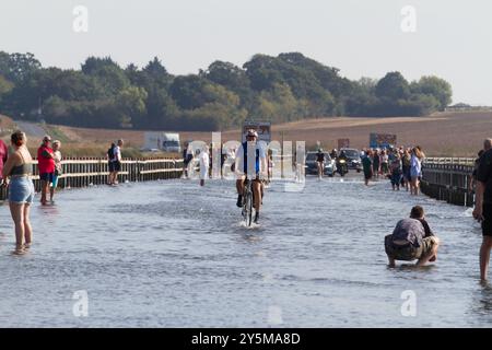 The Strood is the only road on to the island of Mersea in Essex and floods during spring tides as shown here. Stock Photo