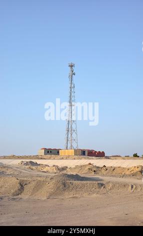 A photo of a telecommunications tower against a blue sky. Stock Photo