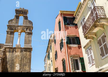 Corfu Greece,Old Town,Agia Sofia,former church bell tower belltower,remaining ruin,residential apartment buildings,balcony windows shutters,city skyli Stock Photo