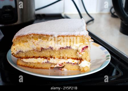 A large piece if Victoria Sponge Cake on a plate Stock Photo