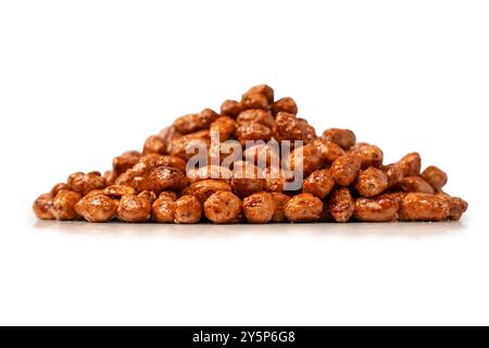Tasty sweet roasted peanuts isolated on a white background. Stock Photo