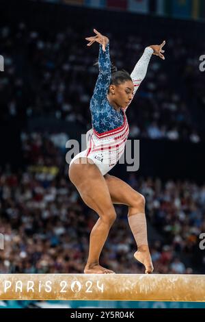 Simone Biles USA) competes on the balance beam during the Women's Gymnatics Team all-around at the 2024 Olympic Summer Games. Stock Photo