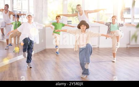 Tween girl mastering krump dance in children dance studio Stock Photo