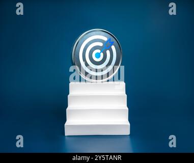 Big round metal target icon on top of modern geometric white staircase as bar graph chart steps on blue background. Business goal, growth process, pro Stock Photo