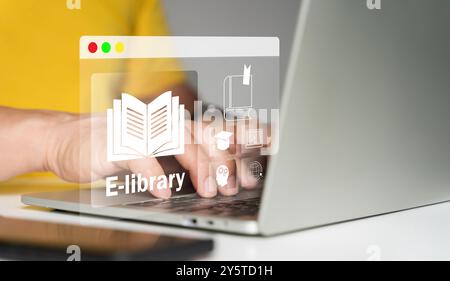 E-library concept. Man use a laptop with virtual Ebook icons for electronic books online, the knowledge base on the internet, digital library, or e-li Stock Photo