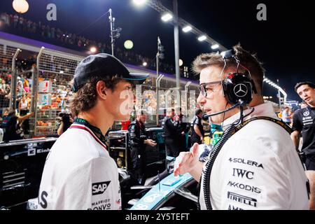 Singapore, Singapore. 22nd Sep, 2024. Mercedes Junior Driver Andrea Kimi Antonelli (L) speaks with Engineer Peter Bonnington (R) on the starting grid ahead of the F1 Grand Prix Singapore at the Marina Bay Street Circuit. Credit: SOPA Images Limited/Alamy Live News Stock Photo