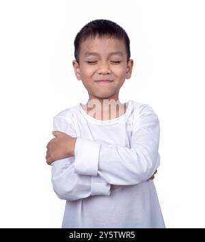 Portrait of asian boy wearing a white shirt posing showing happiness isolated on white background. Stock Photo