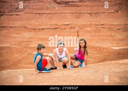 Happy children visiting Monument Valley in Arizona. Stock Photo