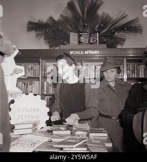 America of the 1940s. Vintage photo of R. H. Macy and Company department store during the week before Christmas, in the book department. New York. USA. December 1942 By M. Collins, photographer Stock Photo