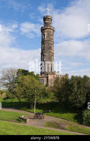 The Nelson Monument and Portuguese Cannon on Calton Hill in city of Edinburgh, Scotland, UK, commemorative tower in honour of Vice Admiral Horatio Nel Stock Photo