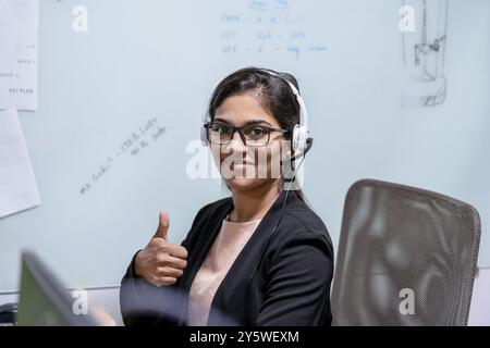 Indian call center telemarketing customer support girl on the phone, professional female telemarketer, customer support representative Stock Photo