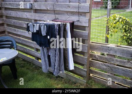 Clothes are drying on a metal rack in the backyard Stock Photo