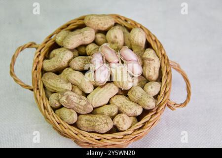 Close-up of peanuts in wicker basket Stock Photo