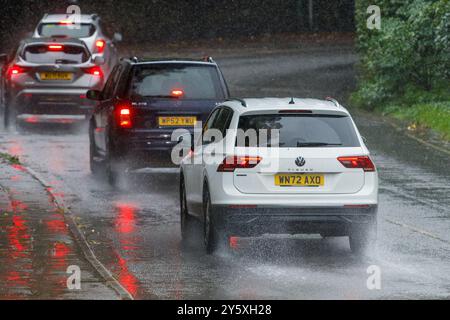 Chippenham, Wiltshire, UK, 23rd Sep, 2024. Drivers are pictured braving very heavy rain in Chippenham as torrential showers make their way across Southern England.Credit: Lynchpics/Alamy Live News Stock Photo