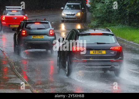 Chippenham, Wiltshire, UK, 23rd Sep, 2024. Drivers are pictured braving very heavy rain in Chippenham as torrential showers make their way across Southern England.Credit: Lynchpics/Alamy Live News Stock Photo