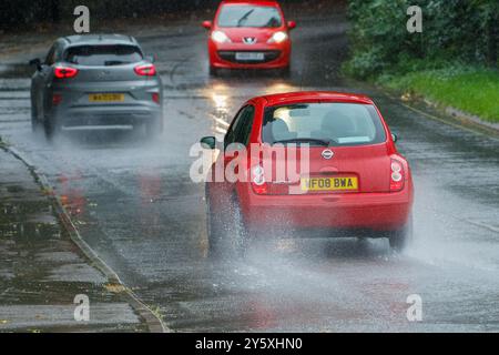 Chippenham, Wiltshire, UK, 23rd Sep, 2024. Drivers are pictured braving very heavy rain in Chippenham as torrential showers make their way across Southern England.Credit: Lynchpics/Alamy Live News Stock Photo