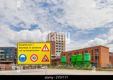 Dutch sign with the text "Construction site - residential area under construction - watch out for construction traffic" Stock Photo