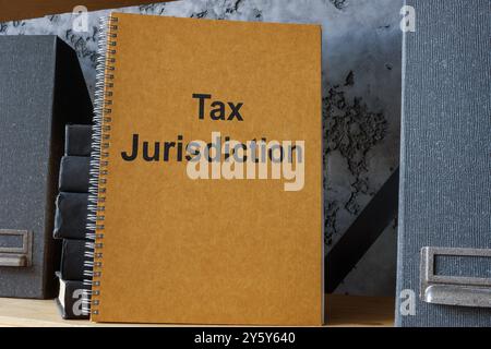 Office shelf with a tax jurisdiction document. Corporate tax management concept. Stock Photo
