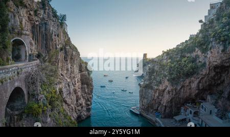 Furore beach bay in Amalfi coast at sunset and road tunnel on the left, panoramic view. Campania region, Italy, Europe Stock Photo