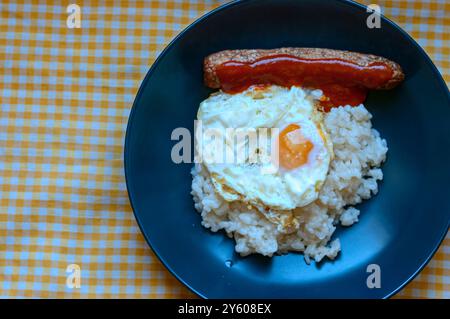 Cuban style rice. With egg, chorizo ​​and spicy tomato. Stock Photo