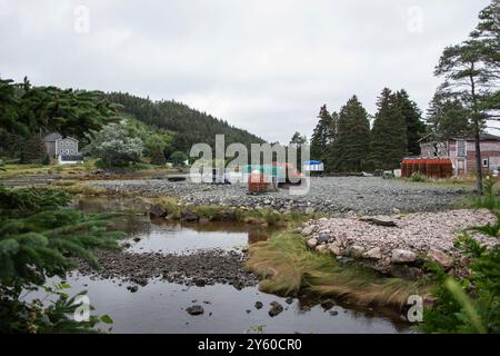 Crab traps and fishing shed on the beach in Conception Harbour, Newfoundland & Labrador, Canada Stock Photo