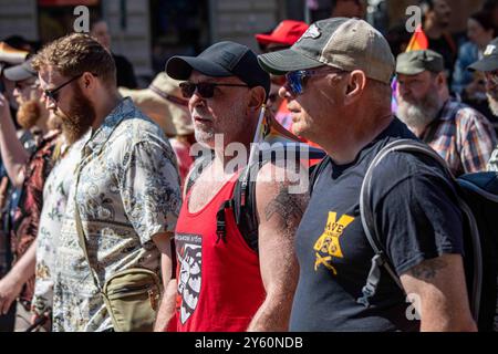 Men at Helsinki Pride 2024 Parade on Mannerheimintie in Helsinki, Finland Stock Photo