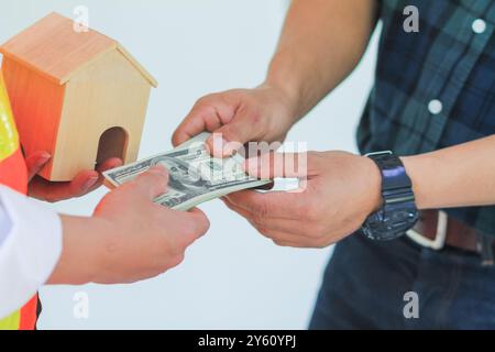 Real estate agents sell houses with clients and offer special privileges because it is a promotion period when the customer has successfully concluded Stock Photo