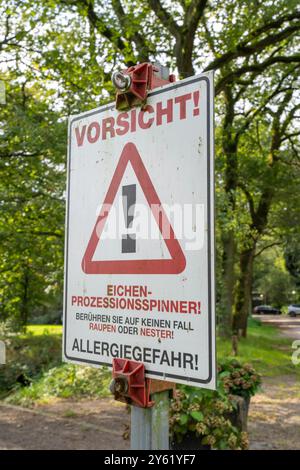 Warning of the oak processionary moth, in a public park, touching can ...