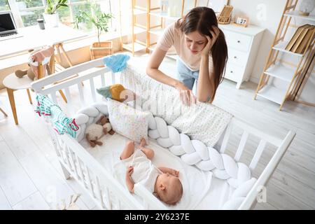 Young mother suffering from postnatal depression at home Stock Photo