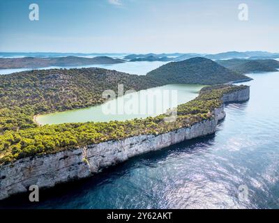 Nature park Telascica, Croatia - August 2, 2024: Telascica nature park cliffs and green Mir lake on Dugi Otok island aerial view, Kornati archipelago Stock Photo