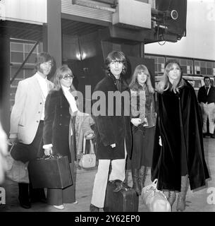 London : Beatle John Lennon and George Harrison pictured at London (Heathrow) Airport today with their wives Cynthia (next to John) and Pattie (right). between George and Pattie is her sister Judy Boyd who is accompanying the other four to India to meditate with Maharishi Mahesh Yogi. 15 February 1968 Stock Photo