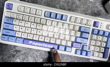 Paperless isolated on laptop keyboard background. Stock Photo