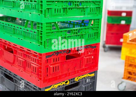 Colored plastic boxes for fruits and vegetables. Industry Stock Photo