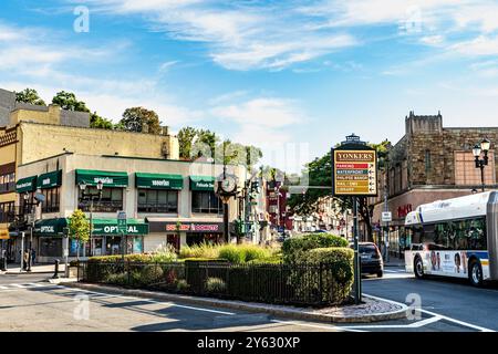 Yonkers, NY - US - Sep 21, 2024 Landscape of people walking through Getty Square in downtown Yonkers, New York. The civic center, central business dis Stock Photo