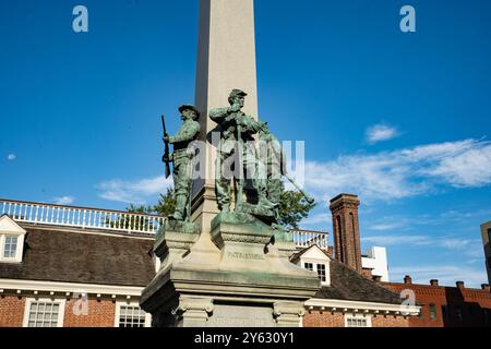 Yonkers, NY - US - Sep 21, 2024 Closeup of the bronze figures on the Yonkers Civil War Soldiers and Sailors Memorial, a tall obelisk with a soldier on Stock Photo