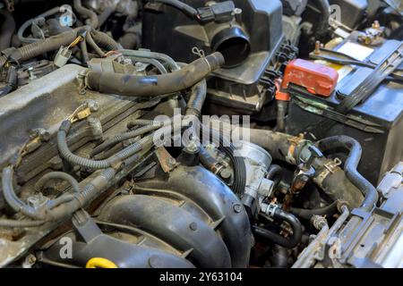 Auto mechanic working in auto garage, master repair service maintenance engine of car Stock Photo